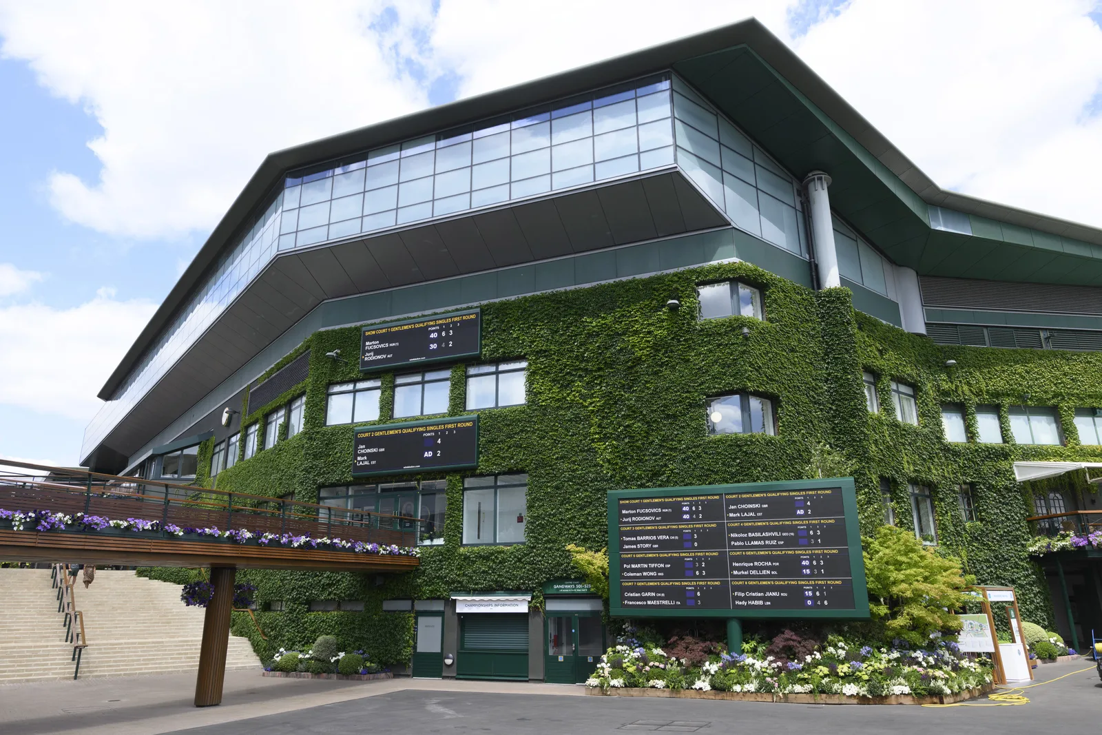 The All England Club is closely associated with Catherine's Wimbledon appearances. Each year, fans look beyond the matches to see what she wears, including the purple-and-green Wimbledon bow pinned to her outfit.