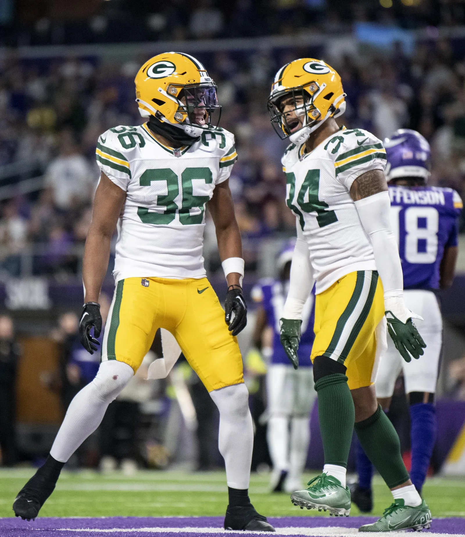 Jonathan Owens and Anthony Johnson Jr. at a game between the Green Bay Packers and the Minnesota Vikings on December 31, 2023, in Minneapolis, Minnesota