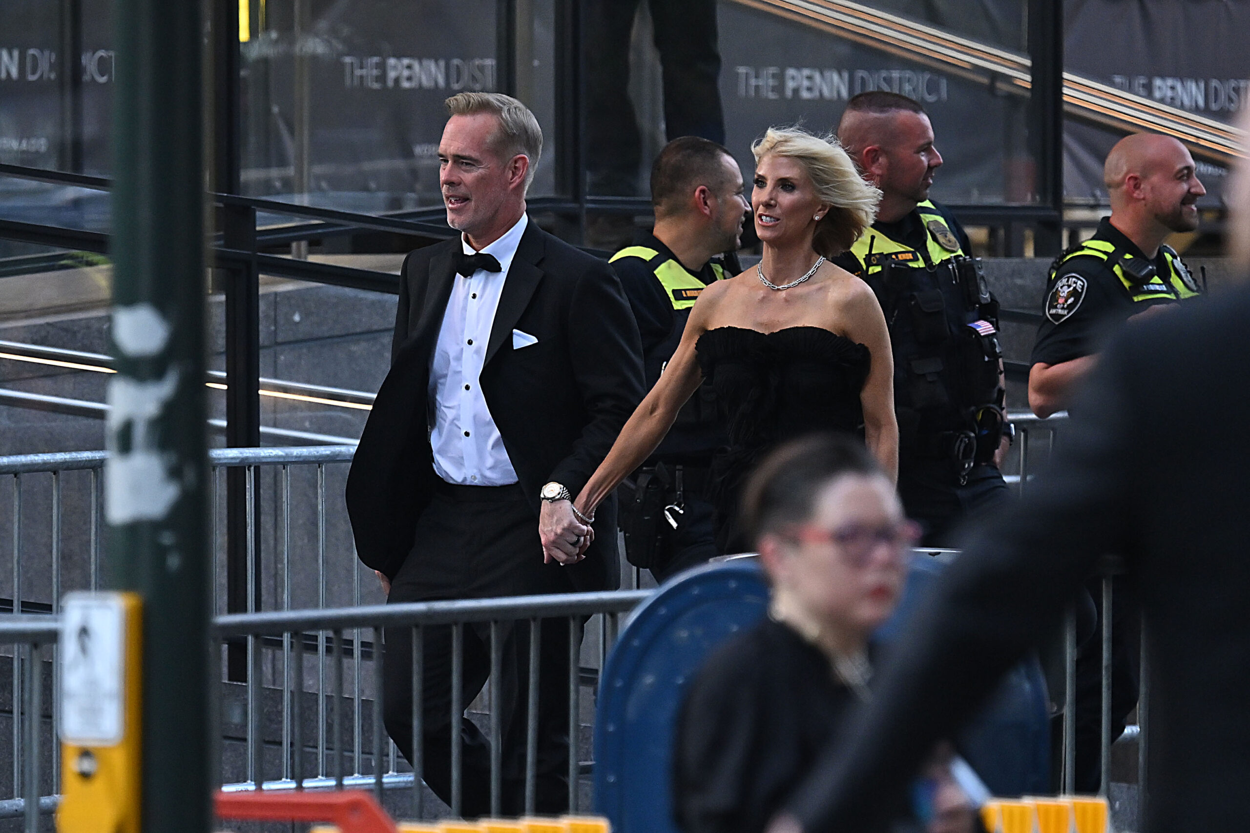 Joe Buck and his wife, Michelle Beisner-Buck, arrive at Madison Square Garden on July 3, 2026, for Taylor Swift and Travis Kelce's wedding. They were among the many guests photographed outside the venue before the ceremony.
