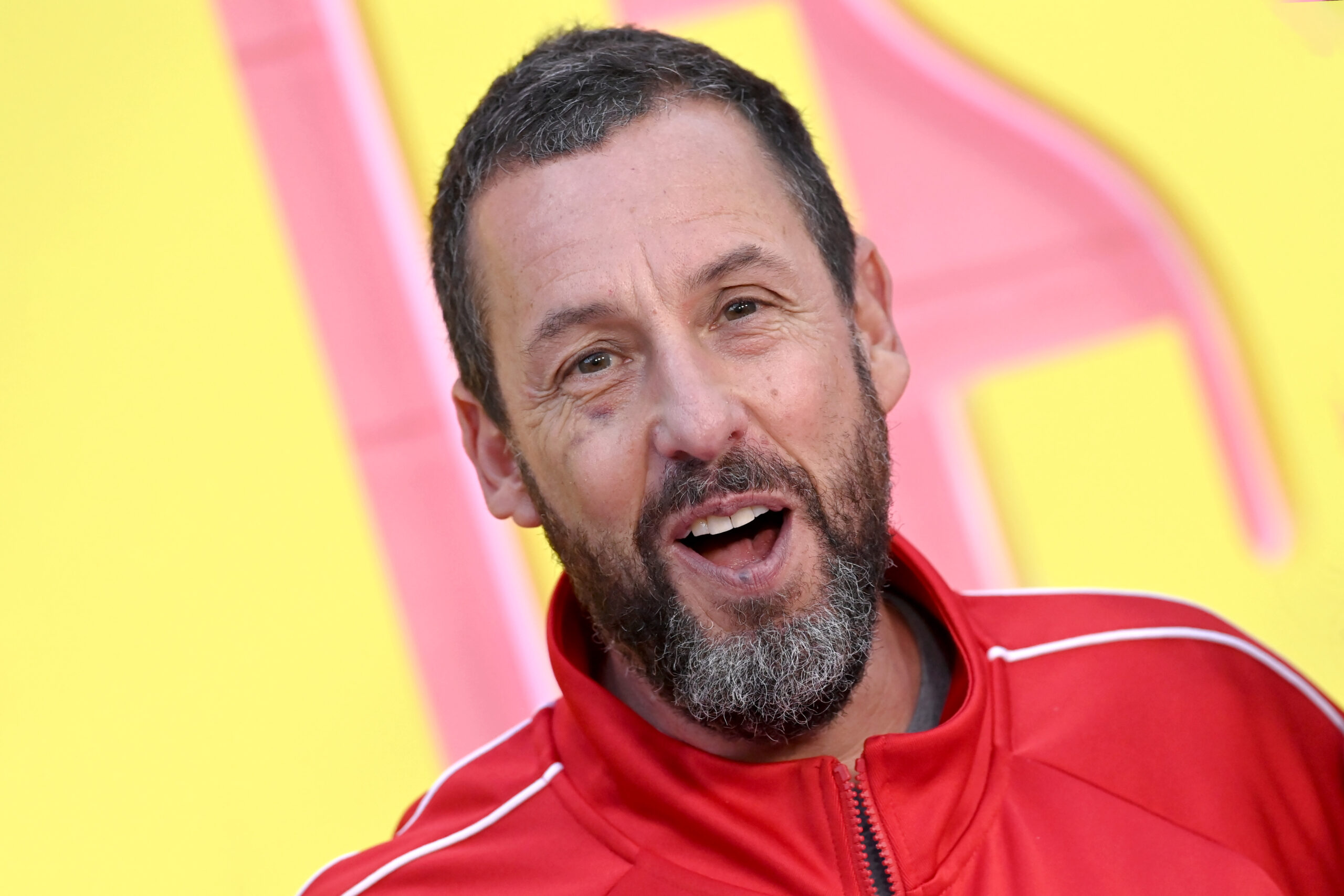 Adam Sandler, pictured at the premiere of "Roommates" in Los Angeles in April 2026, reportedly officiated Taylor Swift and Travis Kelce's wedding, according to Bloomberg and TMZ. Bloomberg later reported that Swift's publicist confirmed Sandler officiated the ceremony.