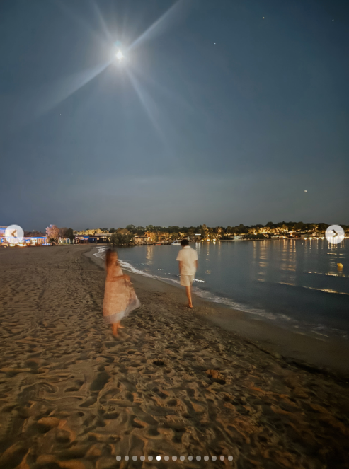 Another photo showed her two younger kids walking the beach at night, but they had changed from swimwear to more appropriate clothes for dinner.