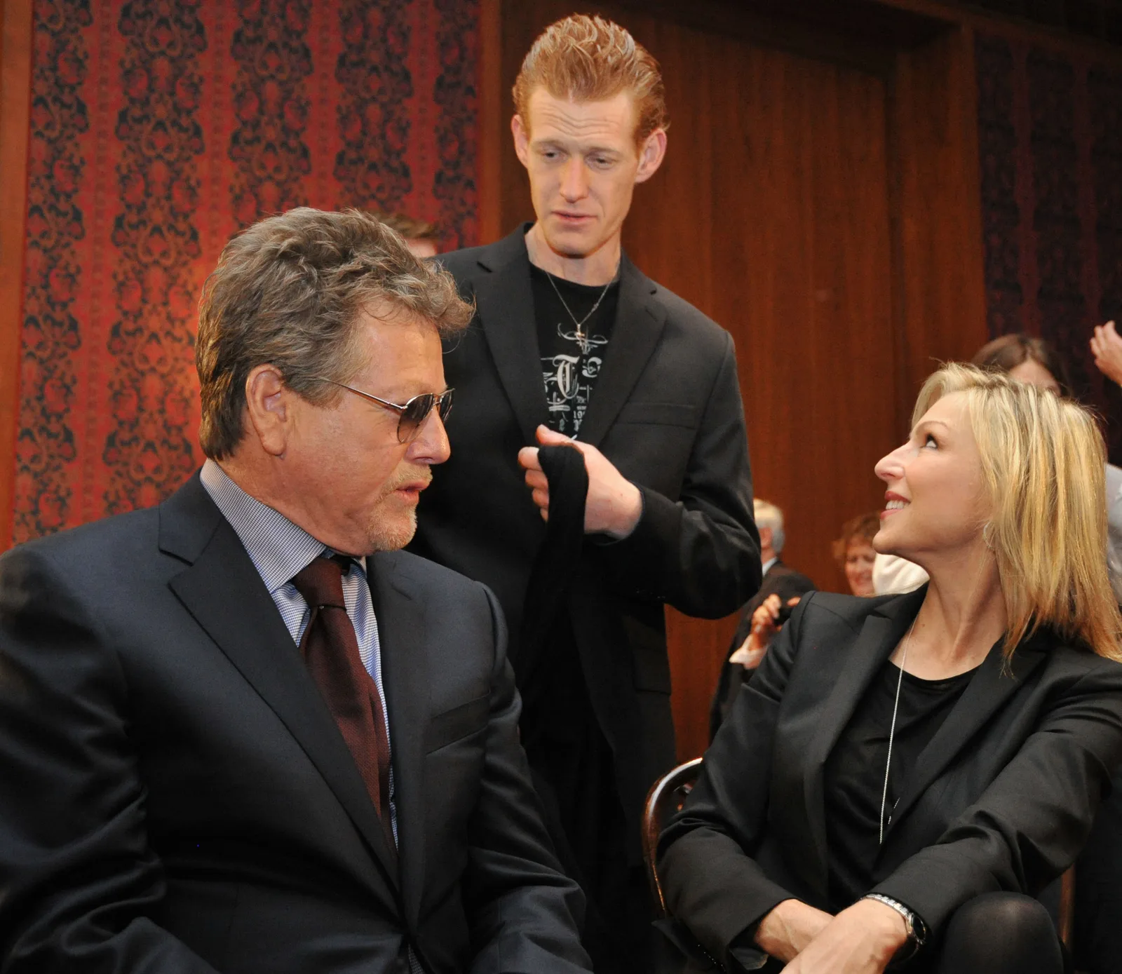 Actor Ryan O'Neal, his son Redmond, and his daughter Tatum following a ceremony in which items belonging to the late actress Farah Fawcett were enshrined in the Smithsonian Institution's National Museum of American History, on February 2, 2011, in Washington, DC.