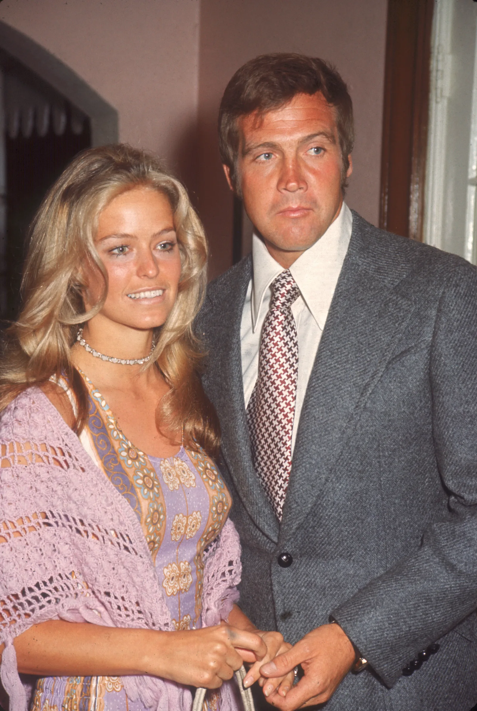 Farrah Fawcett (then known as Farrah Fawcett-Majors) (left) and Lee Majors pose together as they attend a party for ABC-TV screen celebrities in June 1971