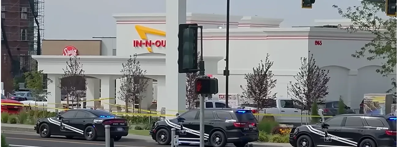 Emergency vehicles surrounded the Twin Falls In-N-Out Burger as investigators began processing the scene following the mass shooting that left three people dead and seven others injured.