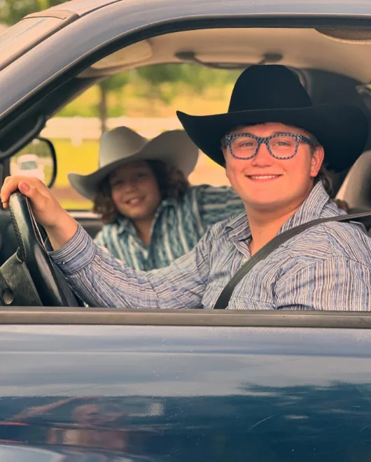 Zuma Rossdale smiled from behind the wheel in a classic black cowboy hat and striped western shirt alongside his younger brother Apollo Rossdale in an image shared on October 19, 2024.