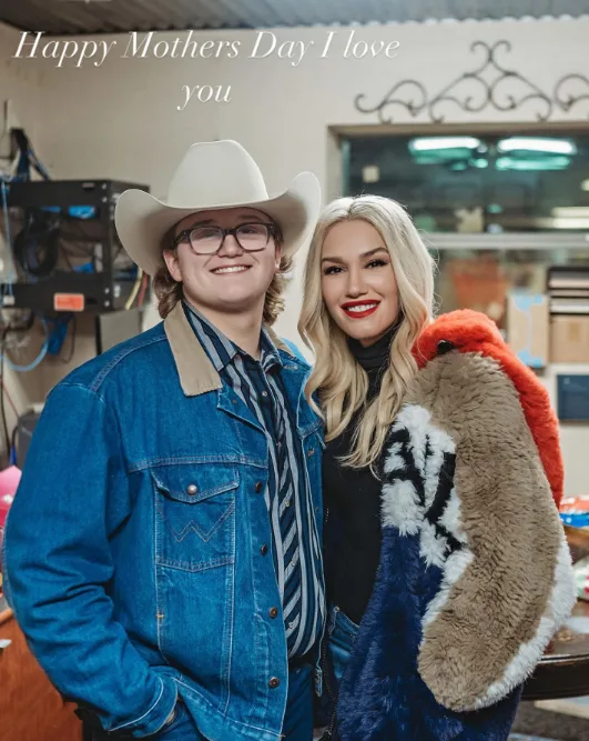 Zuma Rossdale sported a full western aesthetic in a denim jacket, striped button-down shirt, glasses, and a light-colored cowboy hat as he posed alongside his mother, Gwen Stefani. In this photo, they celebrated Mother's Day together in an image shared on May 11, 2025.