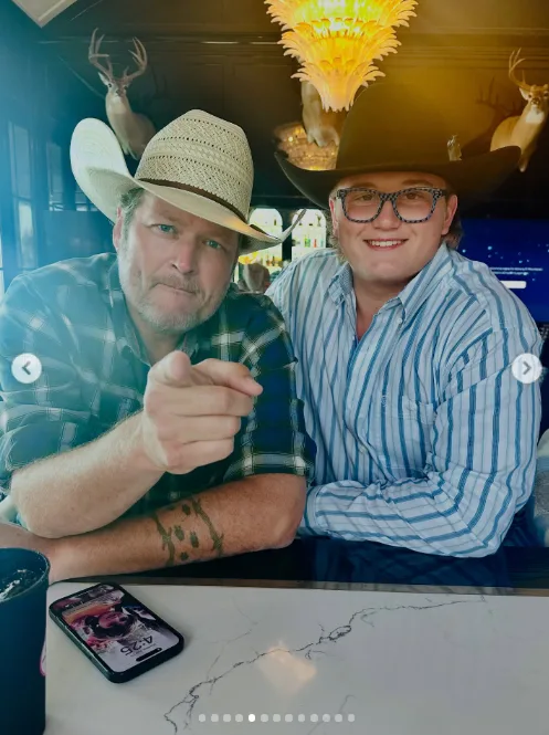 Zuma Rossdale smiled alongside Blake Shelton as both sported cowboy hats and button-down shirts. In this photo, they posed together on August 21, 2025.