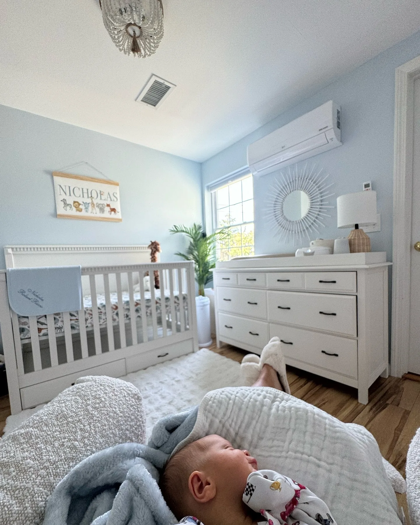 The nursery is perhaps the clearest example of the family home's softer decorating side: light-blue walls, white furniture and warm wood floors create a calm, classic baby-room look. A personalized "NICHOLAS" sign above the crib makes the room unmistakably Niko's.