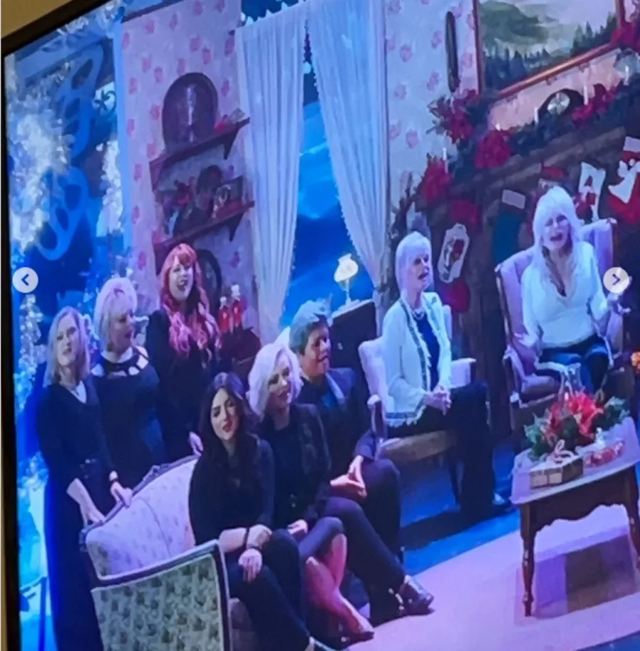 Dolly Parton appears alongside fellow performers in a scene from one of the projects she shared with her great-niece Lainey Mae Parton, whose memories of those experiences have taken on new meaning following her grandmother's death.