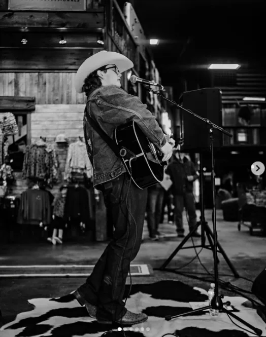Zuma Rossdale played an acoustic guitar at a microphone in a cowboy hat and denim jacket in an image shared on January 13, 2025.