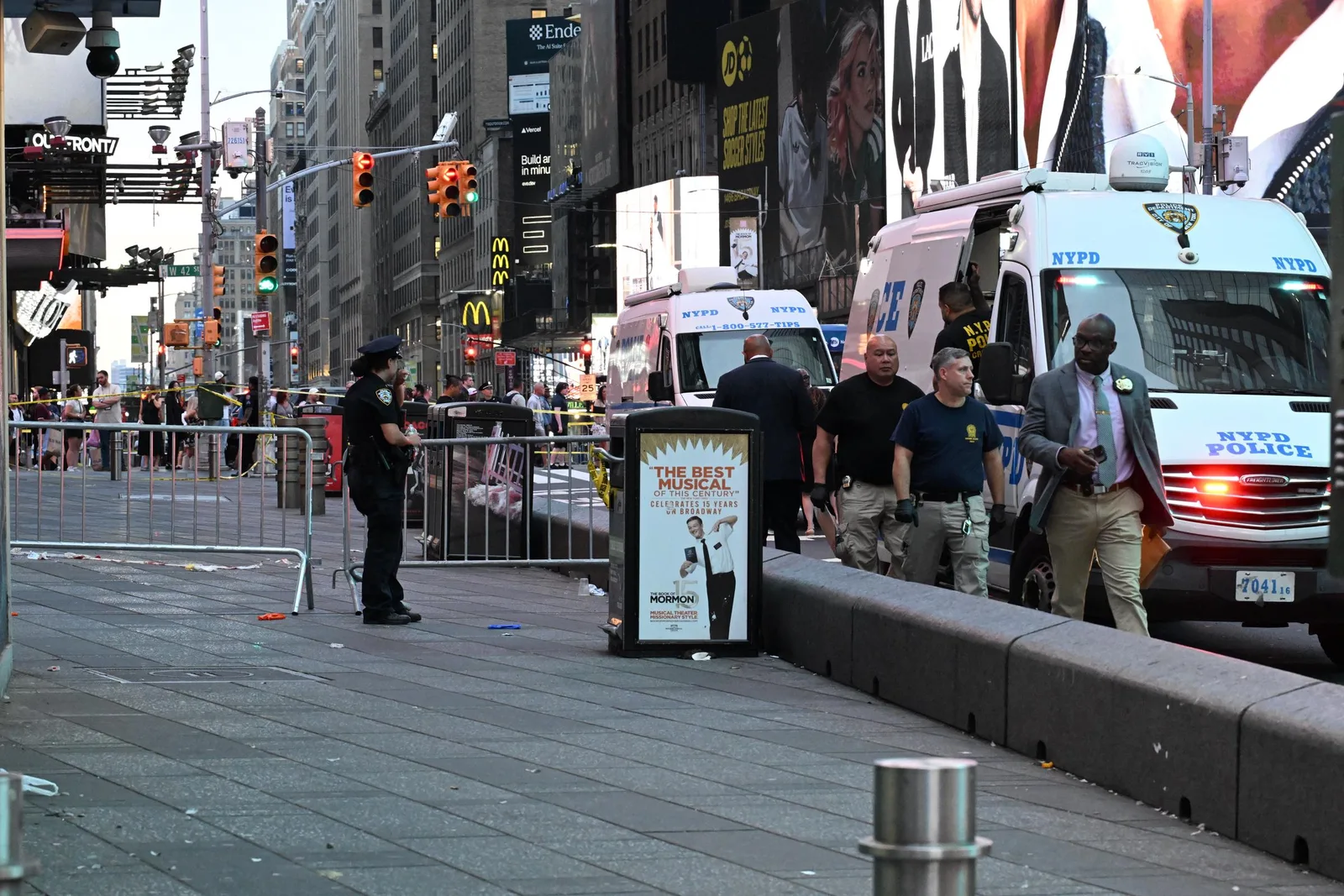 Police secured the Times Square scene after the stabbing attack that left one victim dead and another injured. The confrontation ended with officers shooting Pamela Cisneros after attempts to stop her with Tasers failed.
